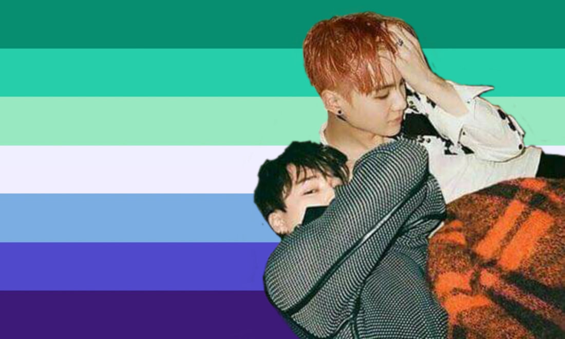 a cutout of yoongi with jimin over the ocean gay flag